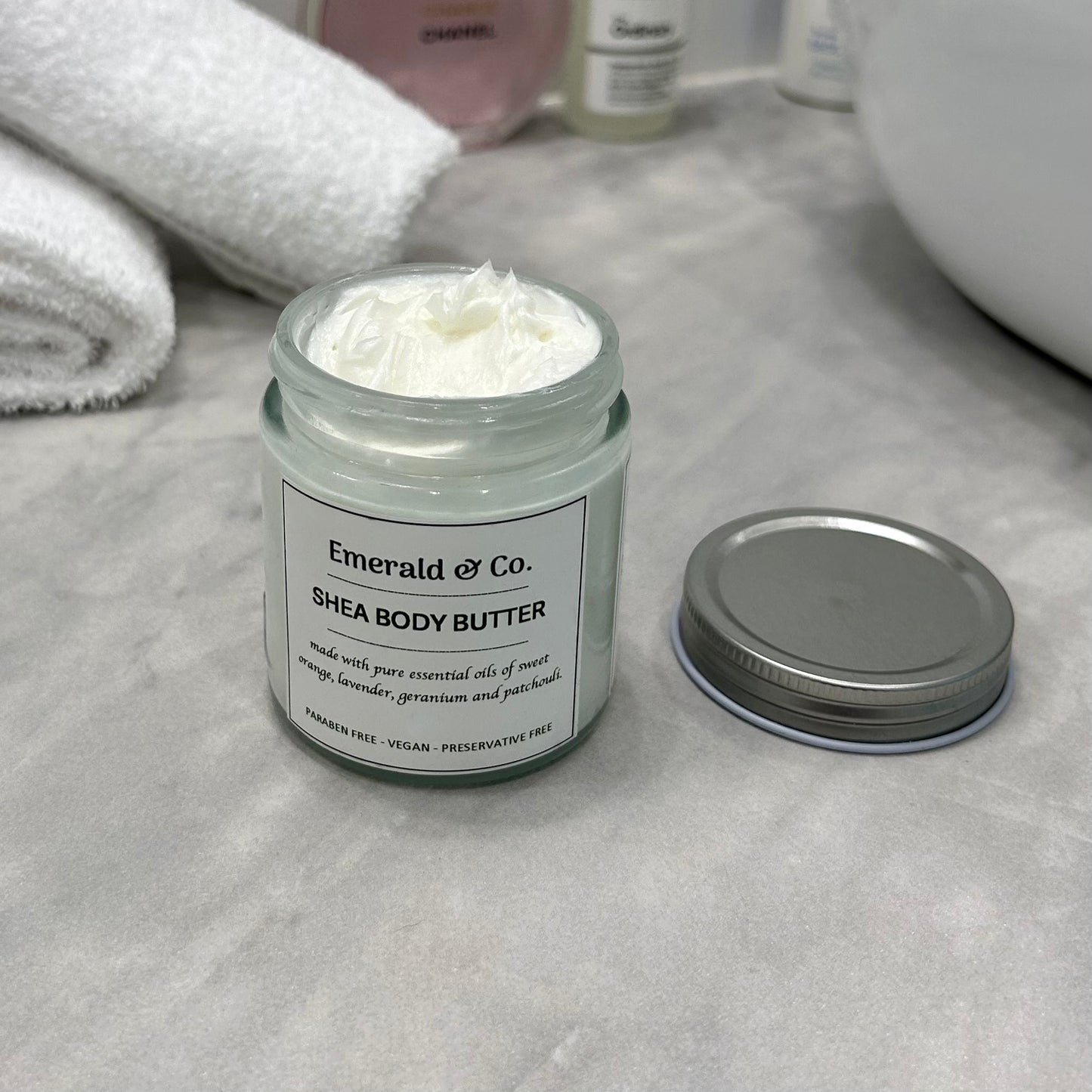 open jar showing white creamy moisturiser